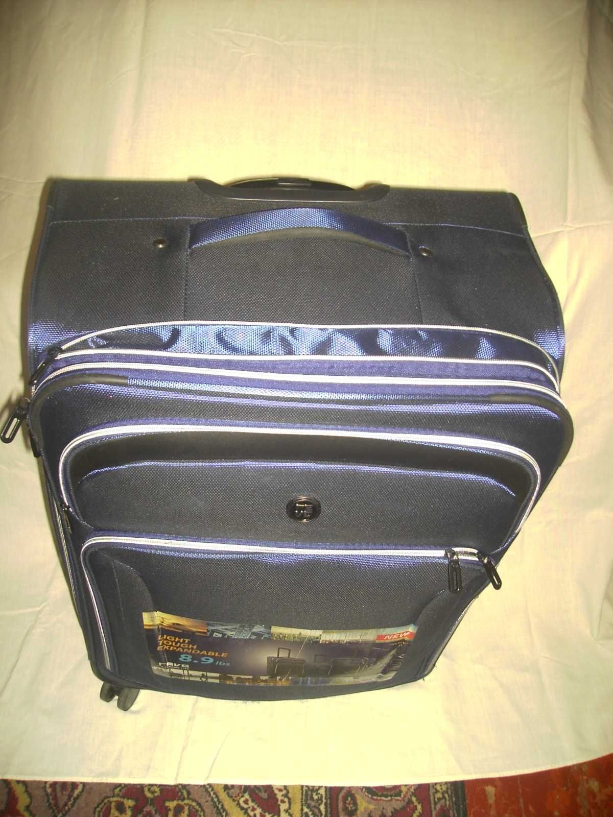 Продам  новый  вместительный багажный чемодан