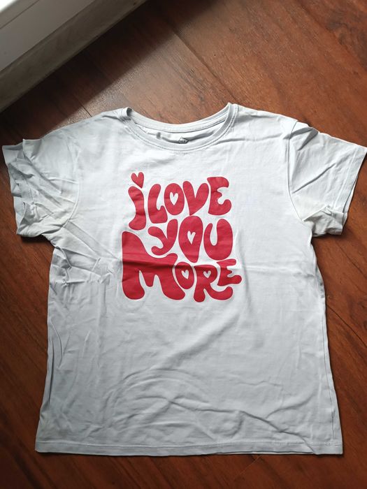 Jasnoniebieski t-shirt z czerwonymi napisami TEX 140/146