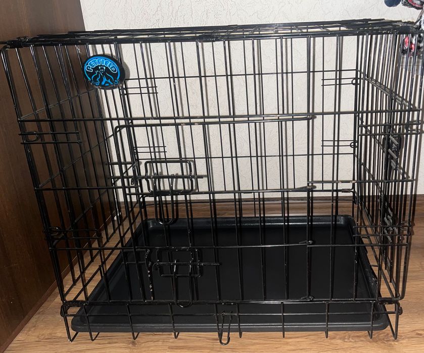Металическая клетка для собак