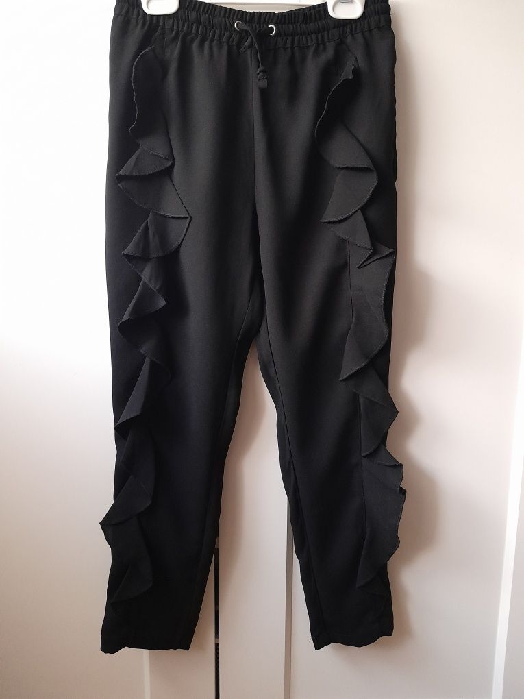Eleganckie spodnie KappAhl 140 czarne.