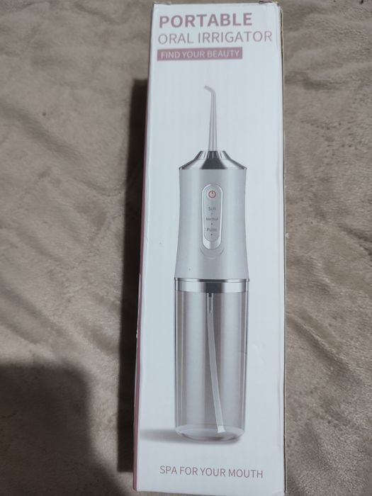 Irrigador oral elétrico portátil