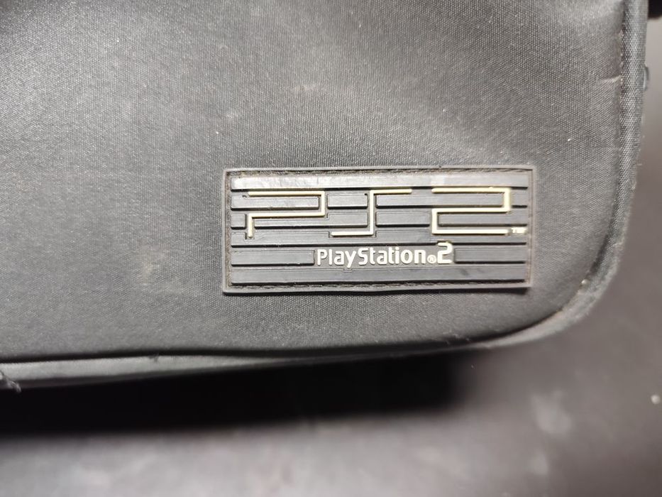 Mala original da PlayStation 2 com sinais de usos