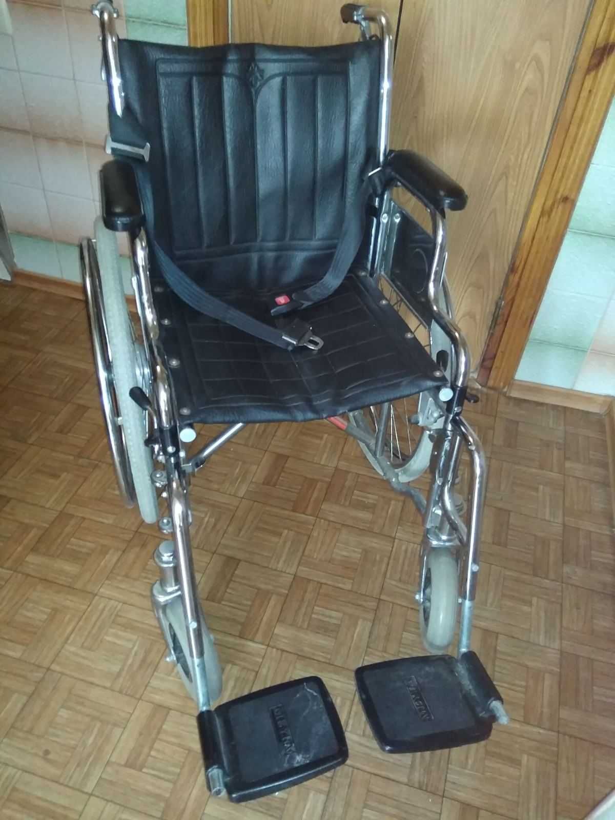 Инвалидная коляска.