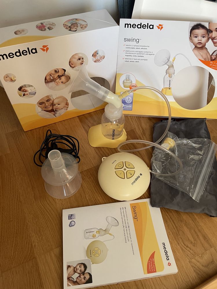 Laktator Medela Swing + 10 butelek