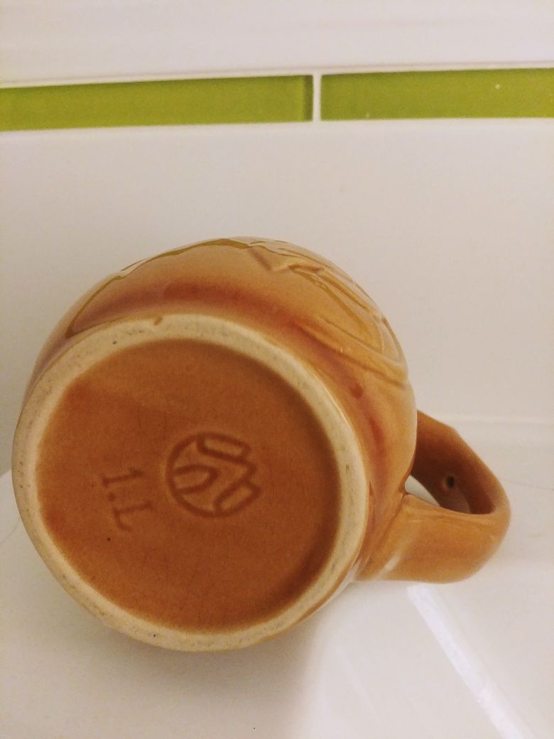 Kufel ceramiczny na 2 zdjęciach