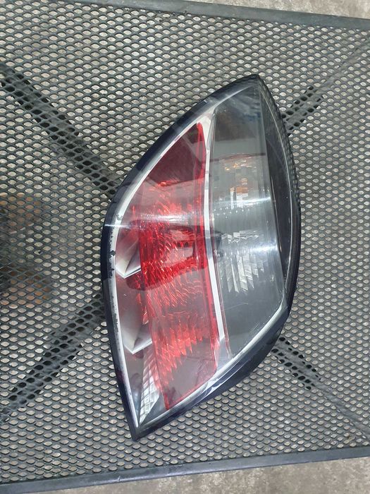Lampa tył tylna lewa Opel Astra H 3 III Gtc 3 drzwi lift europejska