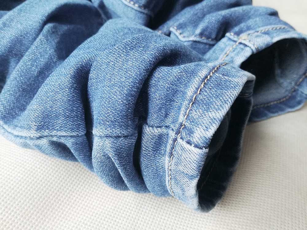 Spodnie wyszczuplające klasyczne push up wysoki stan jasny jeans
