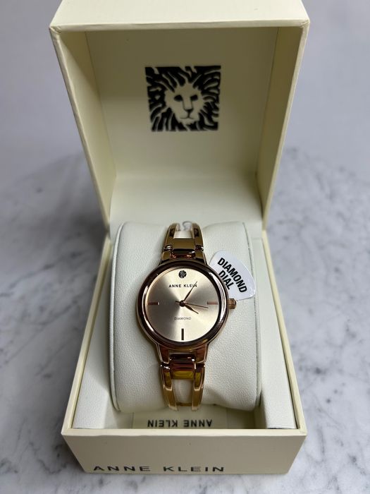Жіночий годинник Anne Klein AK/2626RGRG золотистий з камінцем