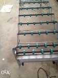 Mesa de transporte de roletes extensivel