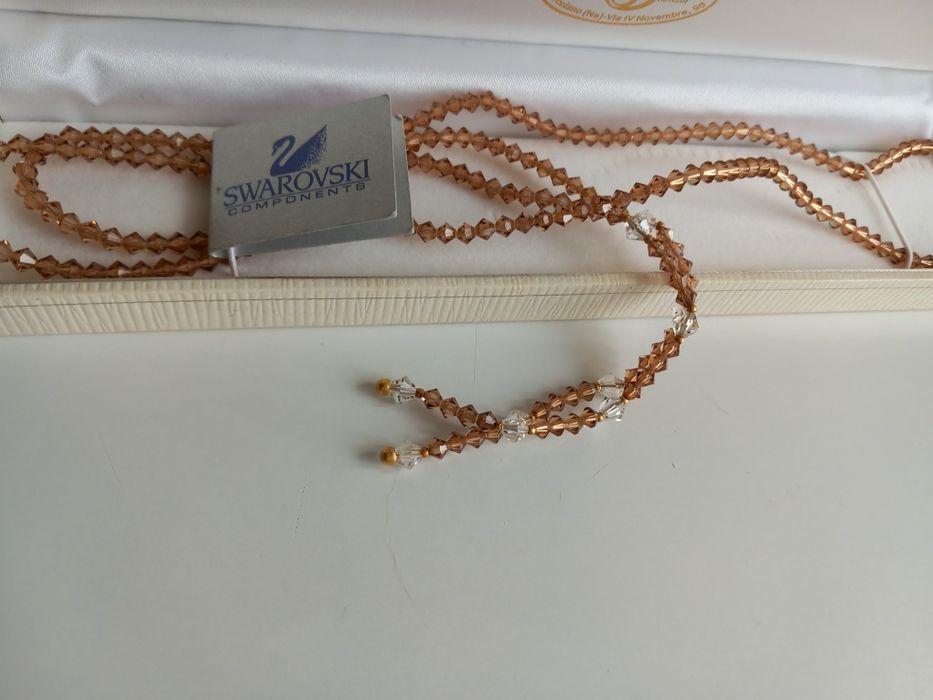 Хрустальна нитка Swarovski з750пр.золотабусинами.