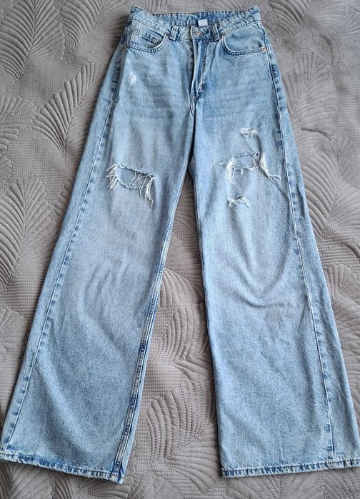 Spodnie jeansowe dzwony z dziurami, wąska talia, H&M rozm. 34
