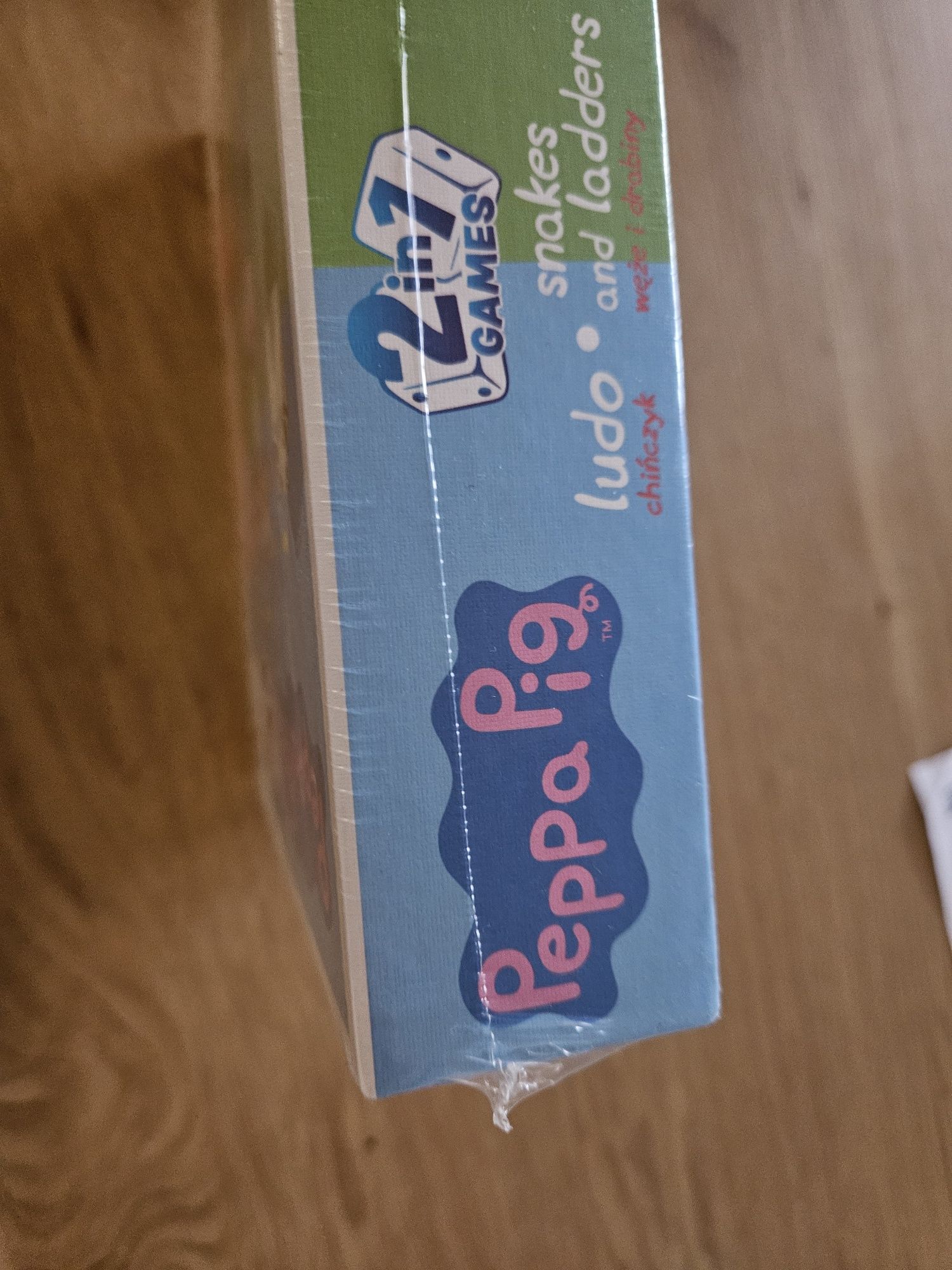 NOWA Ludo = Chińczyk. Snakes and ladders = Węże i drabiny. Peppa Pig