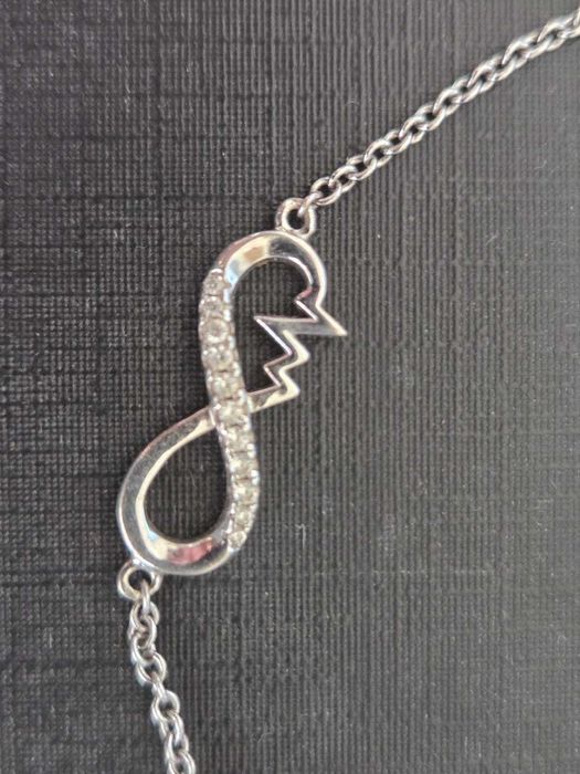 Bransoletka srebrna z cyrkoniami APART z symbolem nieskończoności