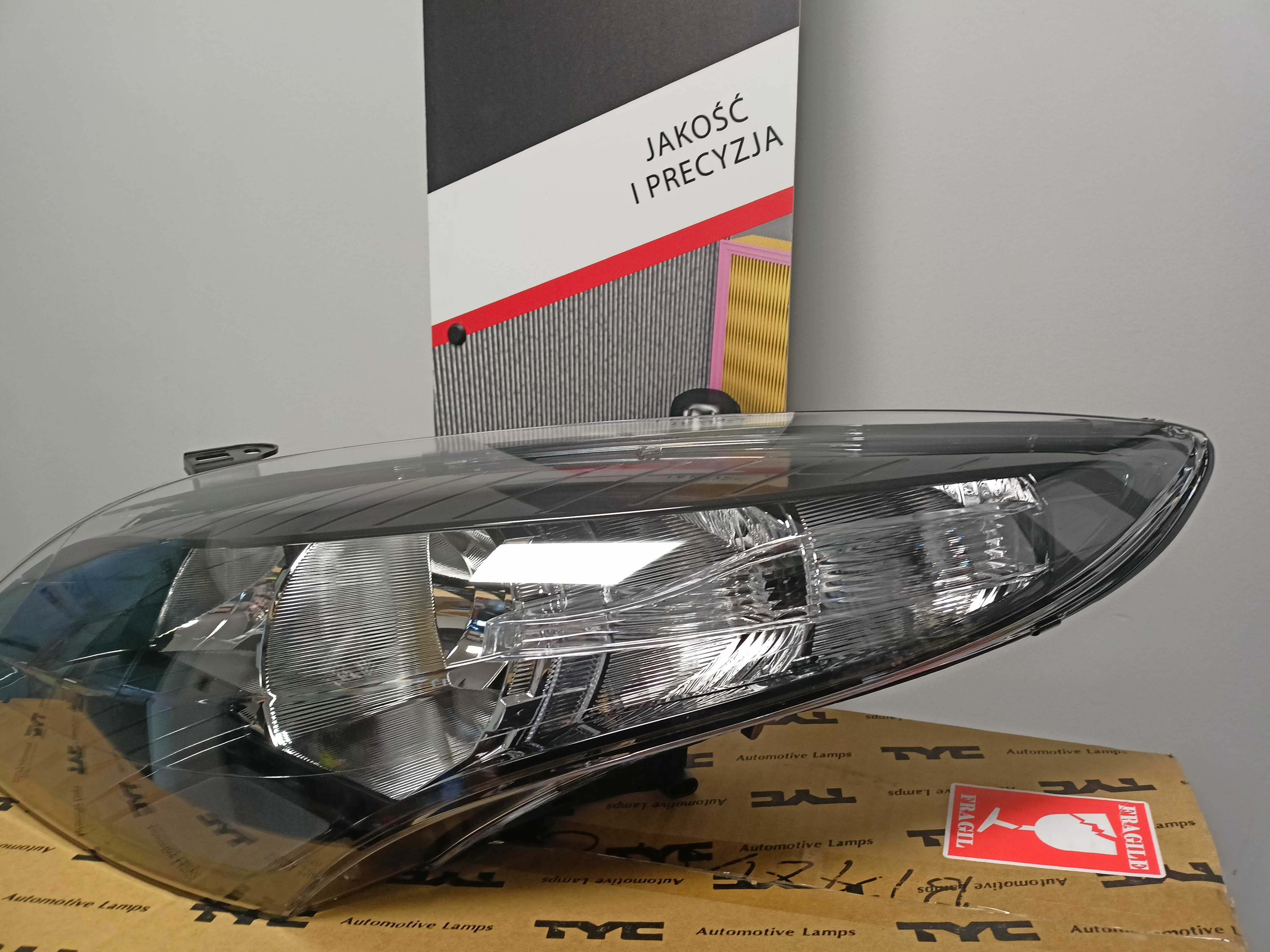 Renault Megane III 08- Lampa/Reflektor czarny środek  lewy/H7/H7