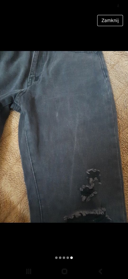 Spodnie jeansowe jeansy 38 M ciemne damskie z dziurami przetarciami
