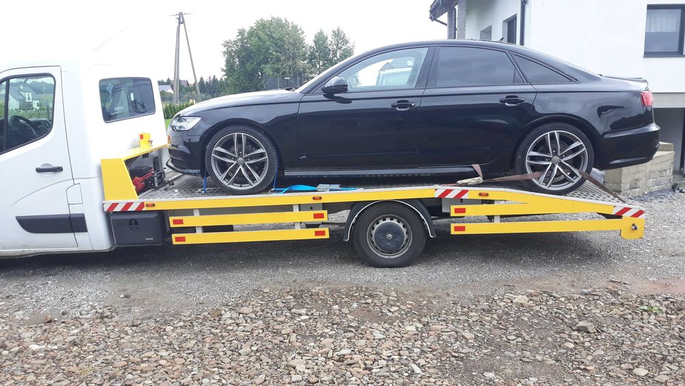 Laweta pomoc drogowa Czechy transport aut