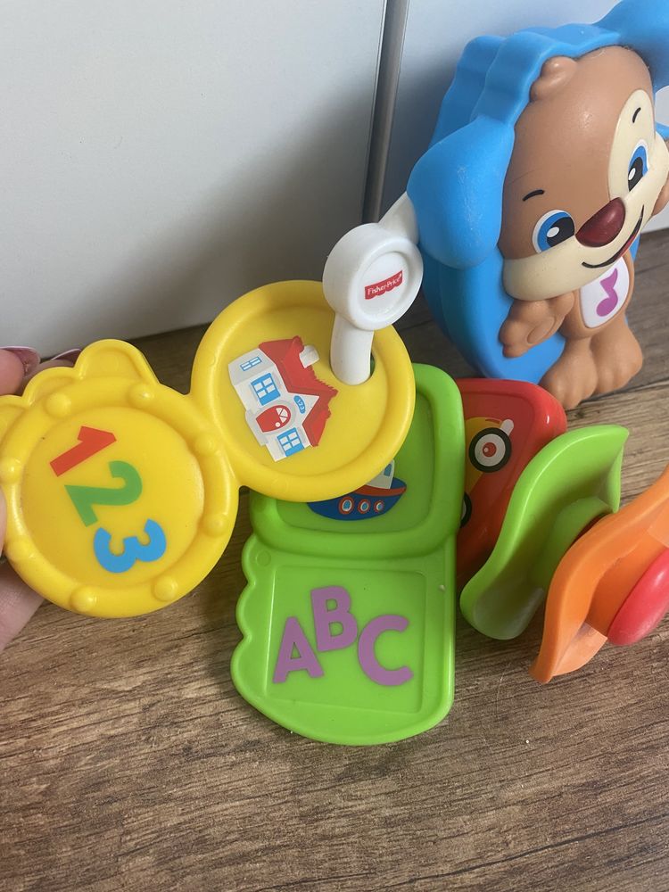 Zabawki niemowlece zawieszki piesek fisher price
