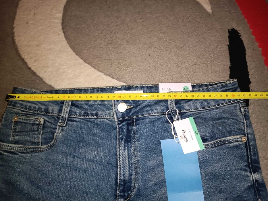 Nowe jeansy dzwony mid waist 42