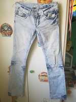 Spodnie jeansy przecierane z dziurami biodrówki jasne roz. 34-36
