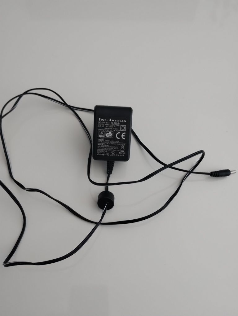 Zasilacz Sino american. Input: 100-230V, 50-60Hz 0.3A. Output: 12V.