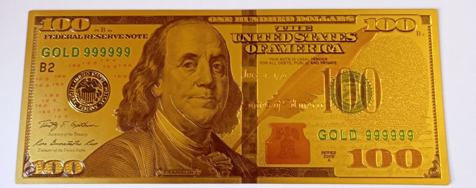Notas de 100 dólares revistidas a ouro