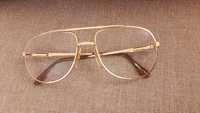 Pozłacane okulary Lacoste
