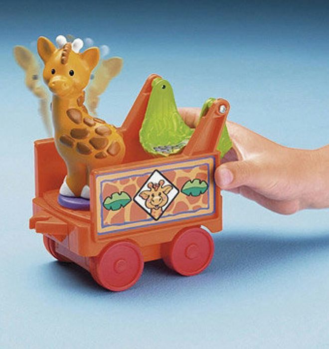 Паровозик из игрушки Fisher-Price "Little People Musical Zoo Train"