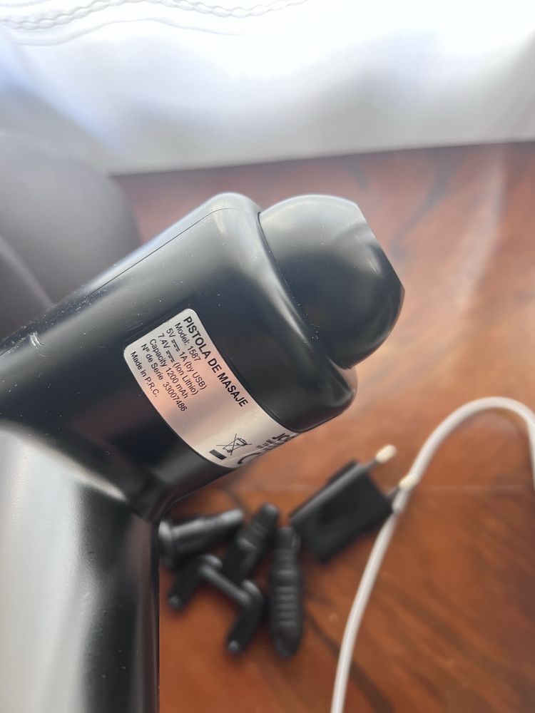 Pistola de massagem desportiva