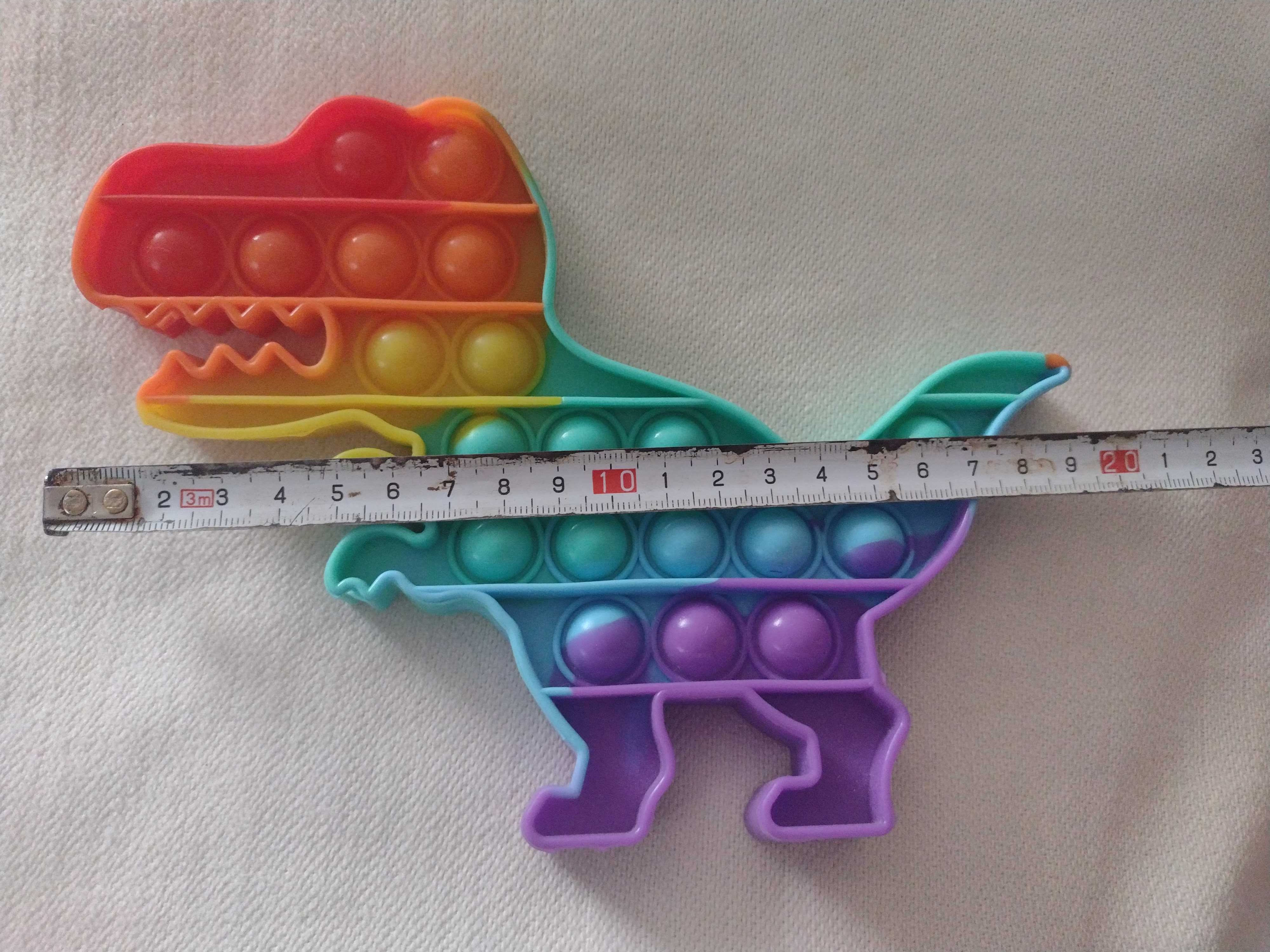 zabawka SENSORYCZNA PUSH BUBBLE POP IT. Dinozaur. Stan idealny