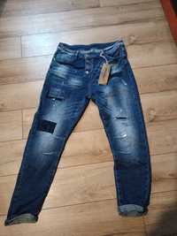 Spodnie Damskie jeans z przetarcia mi rozm L