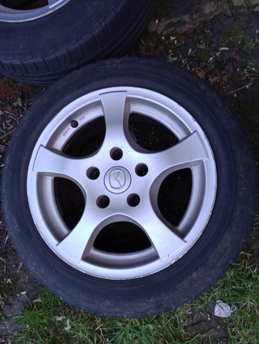 Alufelgi 4 sztuki 5x114 15 z oponami Mazda Mitsubishi