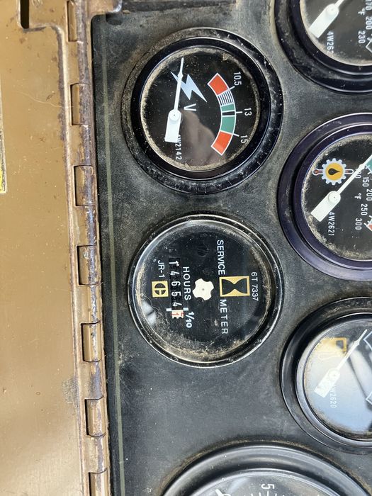 Koparko-ładowarka Caterpillar 438