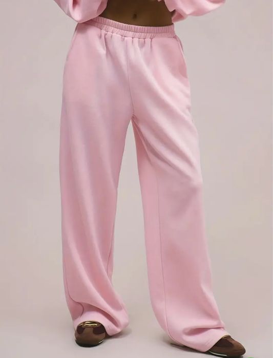 Теплые розовые спортивные оверсайз штаны на флисе клеш