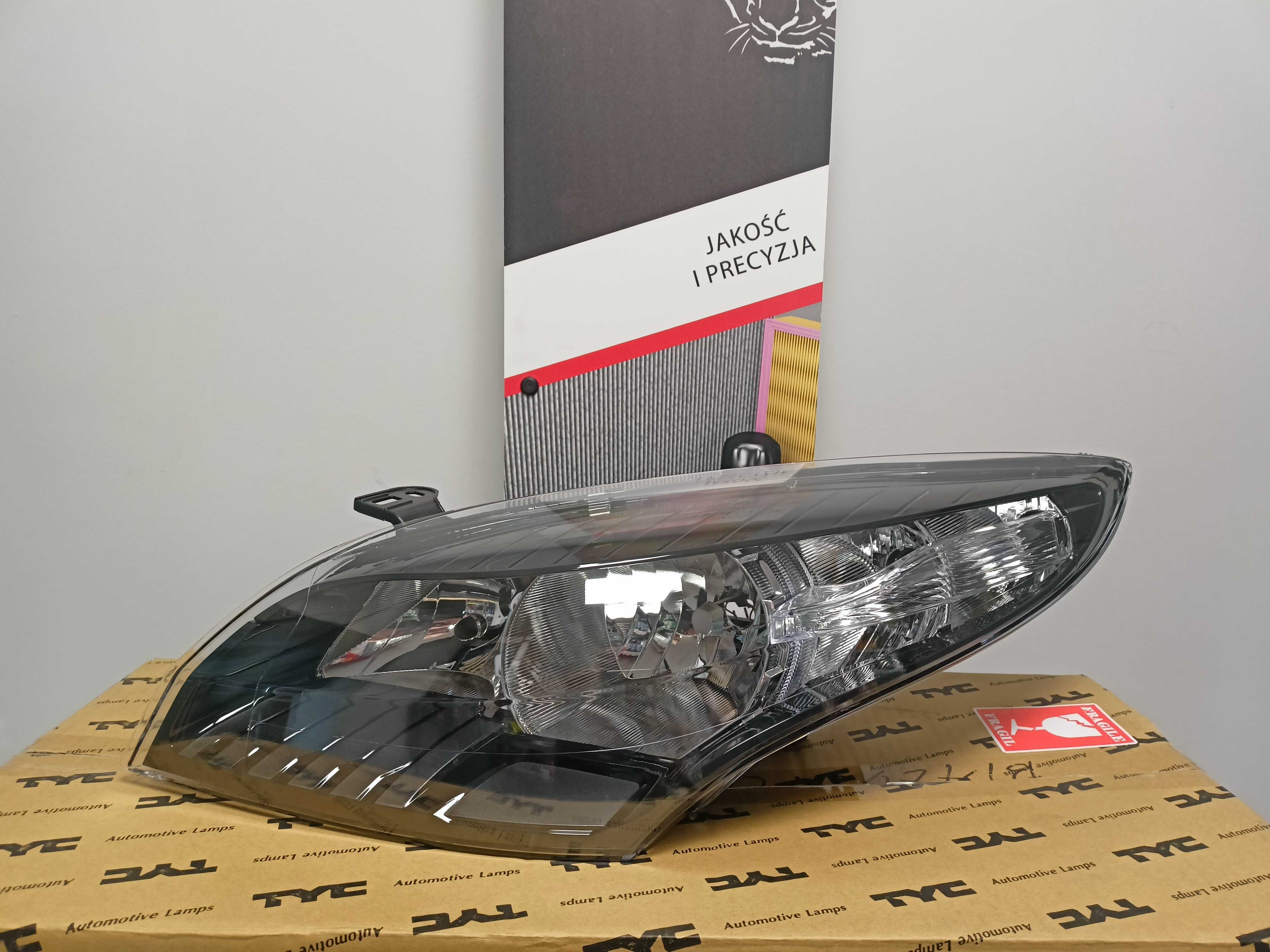 Renault Megane III 08- Lampa/Reflektor czarny środek  lewy/H7/H7