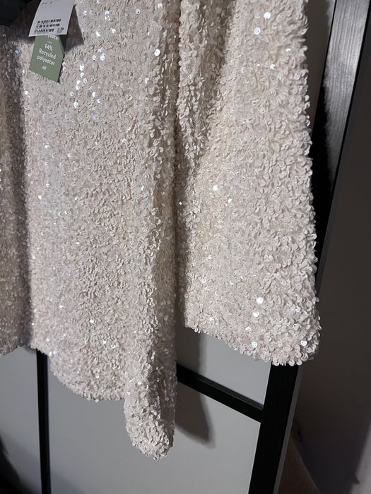 Viralowa sukienka H&M S cekiny cekinowa biała kokarda