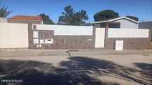 Terreno com moradia T1