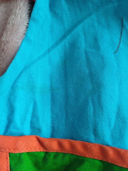Używany fartuszek kuchenny dla dzieci – smok, niebieski z pomarańcz