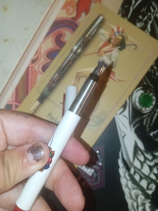 Agenda e caneta da Parker com postal duas revistas de oferta