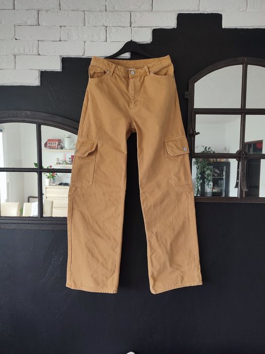 Monki karmelowo miodowe jeansy szerokie nogawki r. M