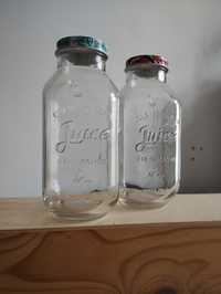 Dwie szklane butelki na napoje, zakrecane
