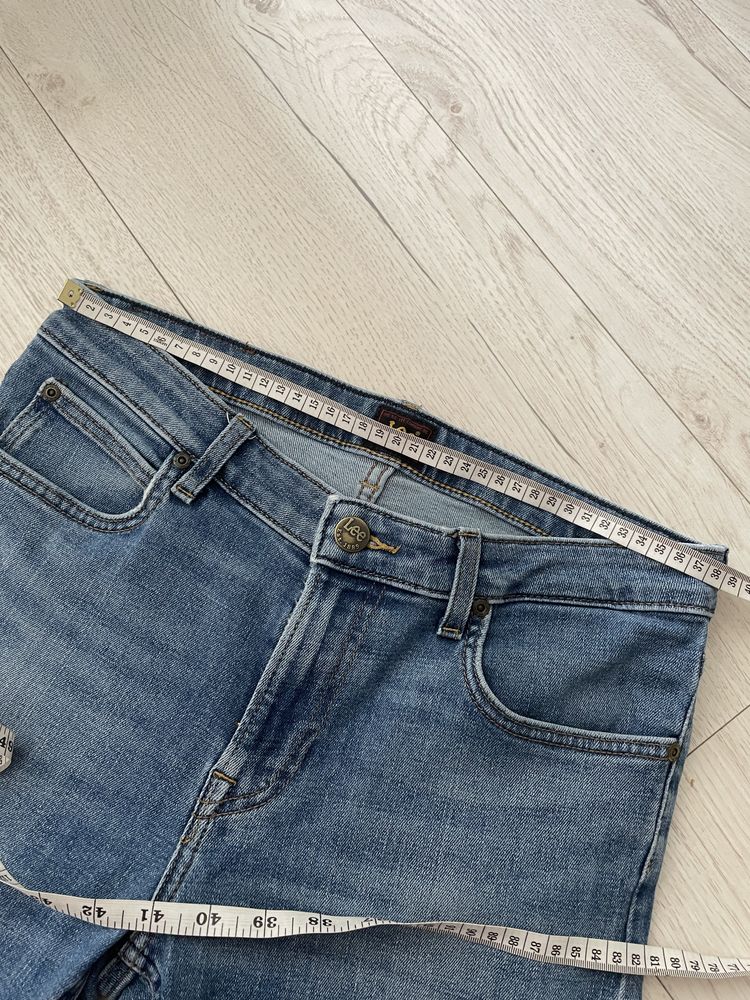 Niebieskie bawełniane meskie spodnie jeansy skinny Lee W30 L34