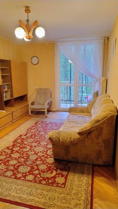 Sofa trzyosobowa, z funkcją spania i skrzynią na pościel, używana