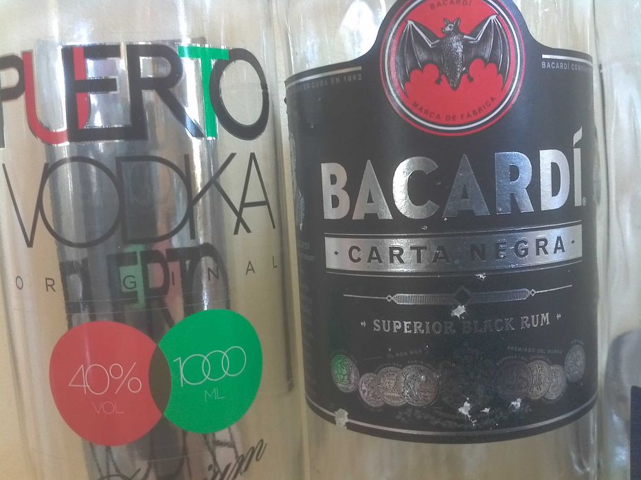 Бутылки из под  водки.