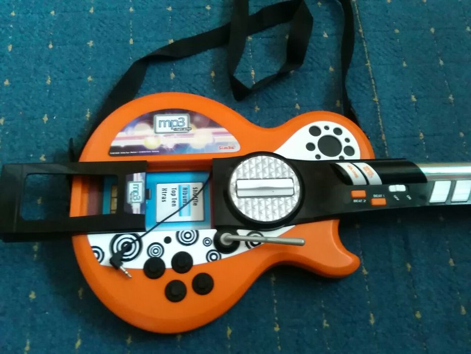 Gitara na baterie plus MP 3