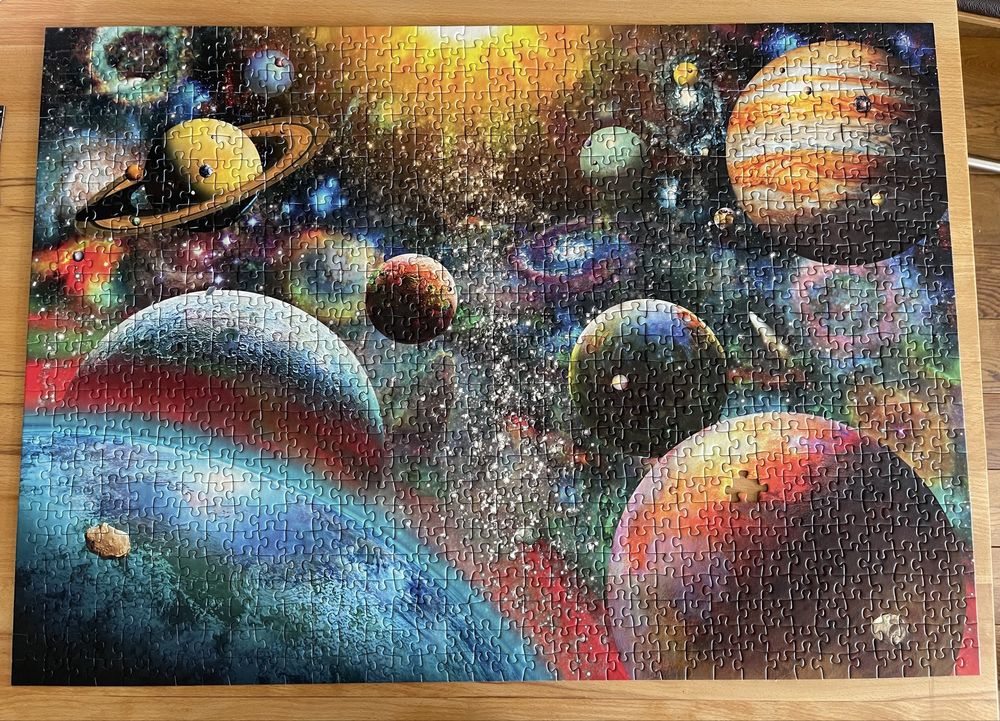 Niekompletne puzzle Kosmos Ravensburger, na kolaż