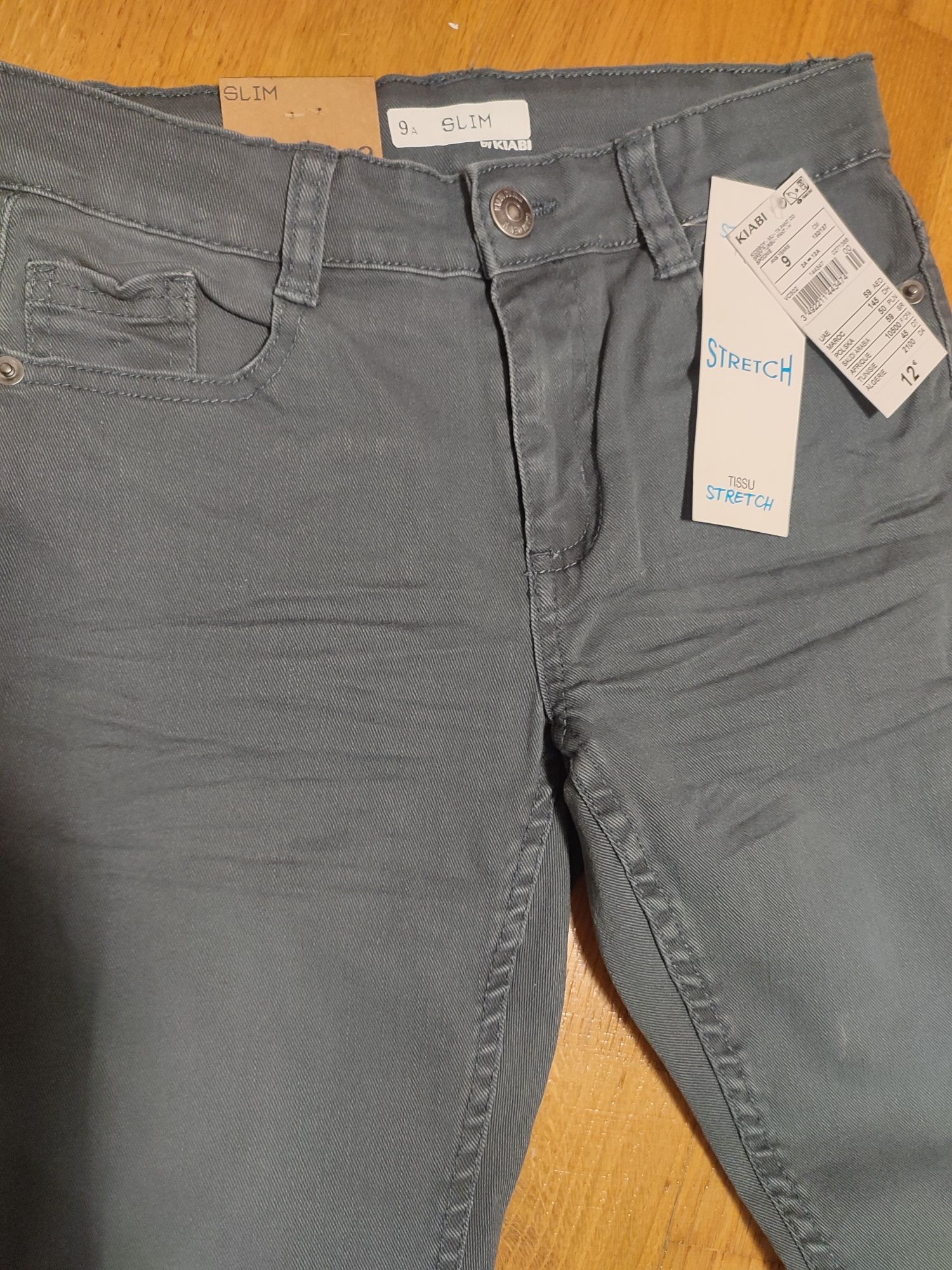 Kiabi spodnie eleganckie szare dżinsy slim stretch r. 134 nowe
