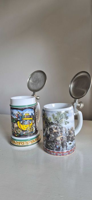 Dwa ceramiczne kufle do piwa z cynowymi przykrywkami
