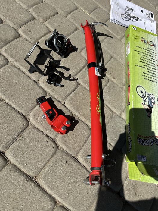 Trail-Gator drążek tandemowy, czerwony. Prowadnica do roweru Uchwyt