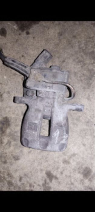 Zacisk Passat B6 tył tylny prawy lewy z silniczkiem elektryczny kompl