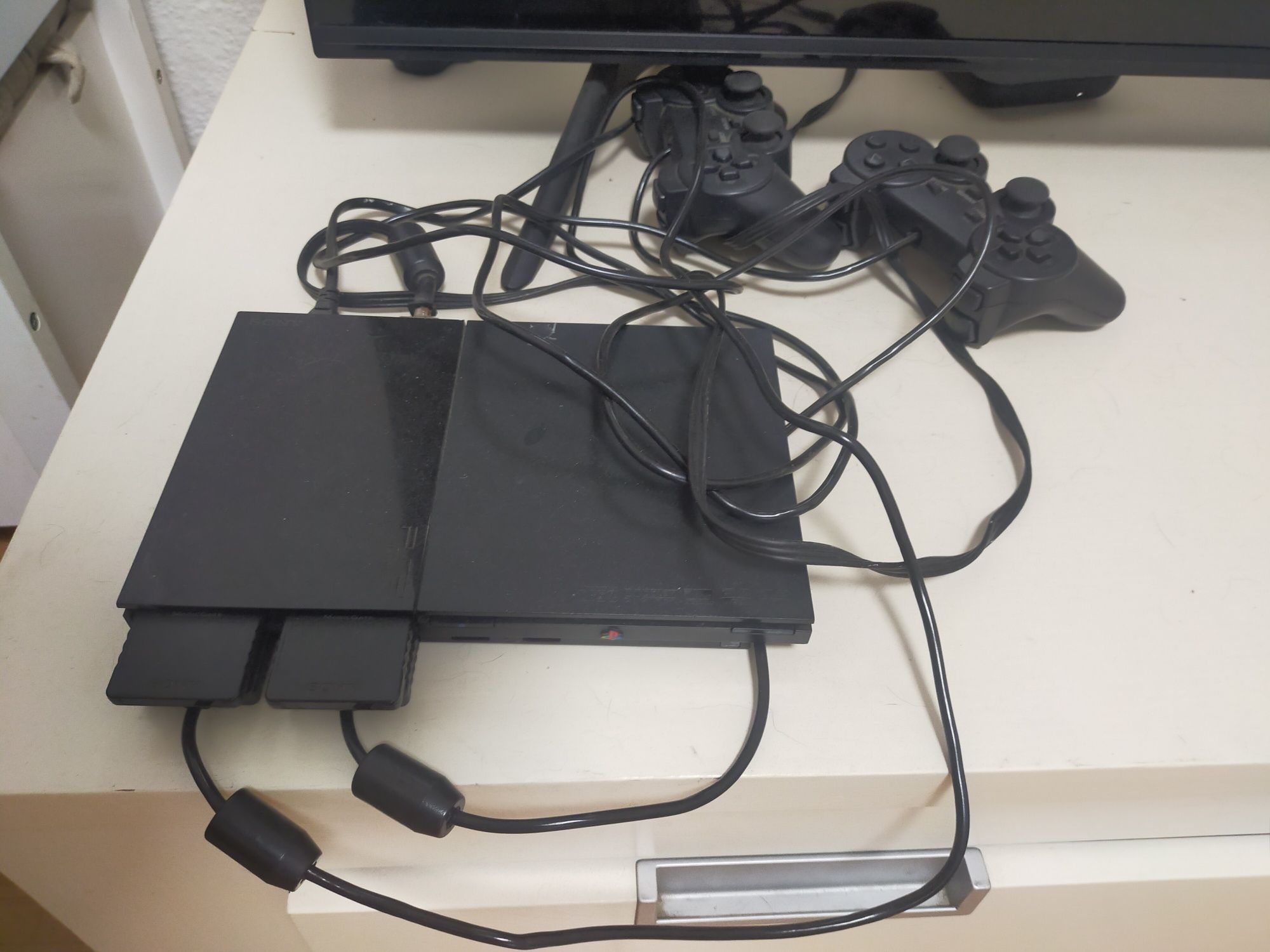 PlayStation 2 com vários jogos